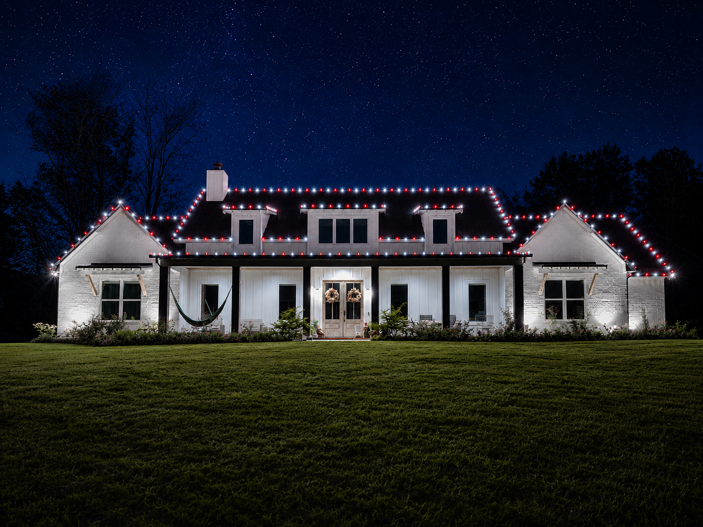 Christmas lights installed on a home in East Texas by Local Lights — Front lower and upper roofline with dormers