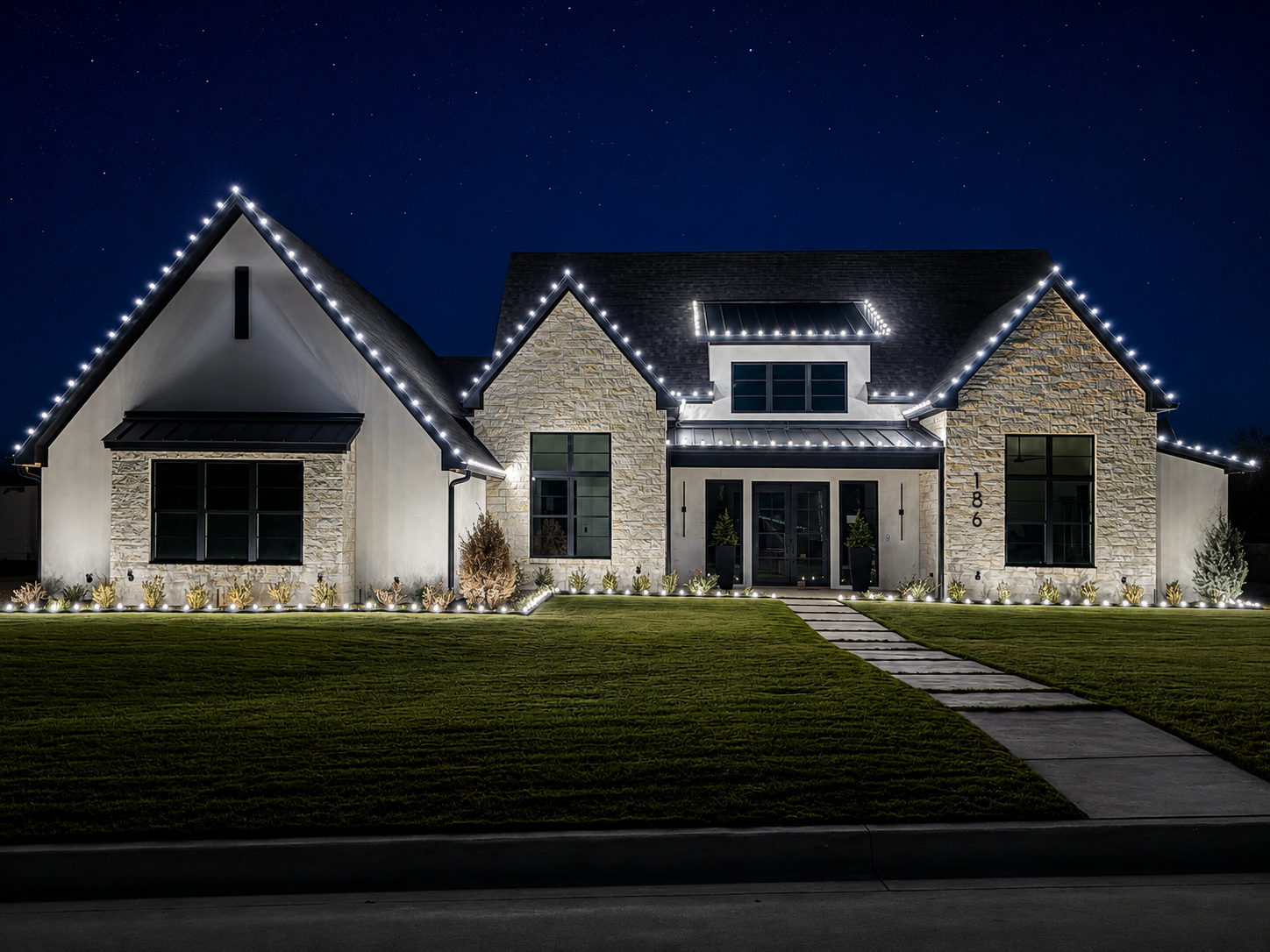 Christmas lights installed on a home in East Texas by Local Lights — Lower rooflines, dormer and stake lights